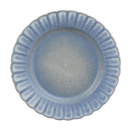 Small round stoneware plate with a fluted rim and scalloped edge, finished in a speckled blue glaze fading to grey-blue at the centre, shown on a plain white background.