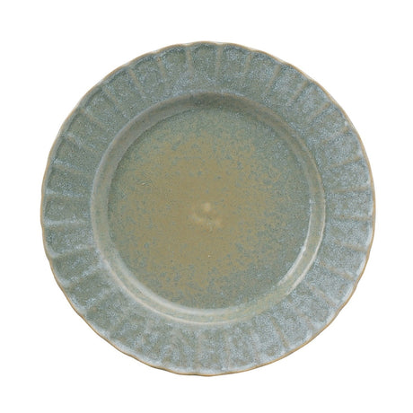 Round stoneware plate with a fluted, raised-panel rim and speckled green glaze, smooth flat centre, shown on a plain white background.