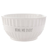 Round white ceramic stoneware bowl with vertical ribbed sides, a smooth central band printed "BOWL ME OVER!" in black text, and a low foot ring, on a plain white background.