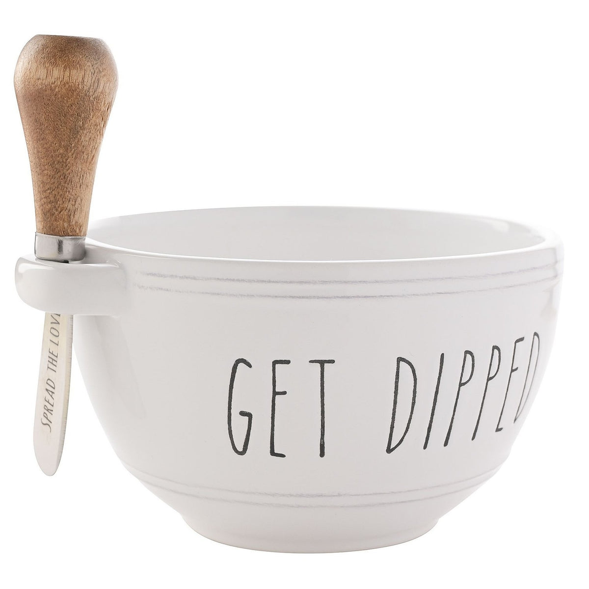 Round white glazed stoneware bowl with "GET DIPPED" lettering, paired with a wooden spreader reading "SPREAD THE LOVE" slotted into a rim handle, on a plain background.