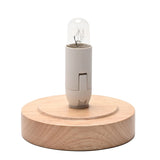 Round wooden lamp base with a small grey E14 bulb holder and clear tubular bulb fitted, shown on a plain white background.