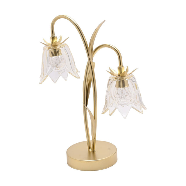 Two-stem LED table lamp with gold curved stems and leaf details, featuring two clear champagne-tinted glass flower shades on a round gold base, shown on a white background.