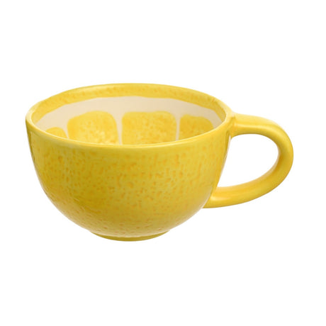 Round earthenware mug styled as a lemon slice, with glossy yellow dappled exterior, cream inner rim with yellow segments, and a loop handle, on a plain white background.