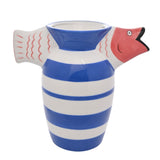 Fish Striped Deco ceramic vase in white with blue stripes, flared neck, coral fish head with open mouth on one side and tail with fin details on the other, shown on a plain white background.
