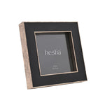 Square metal box photo frame for a 5 x 5in print, black front with fine gold edging and distressed antique gold sides, shown at an angle on a plain white background.