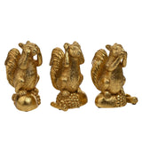 Set of three gold resin squirrel figurines in a "see, hear, speak no evil" pose, each perched on a textured acorn base, shown on a plain white background.
