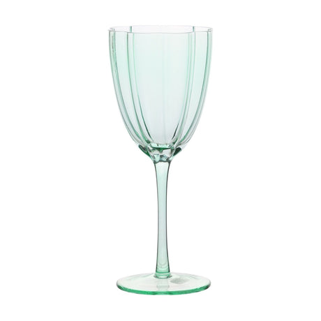 Green fluted stemmed wine glass with scalloped rim edge, vertical panelled bowl, slender stem, and flat round foot on a plain white background.