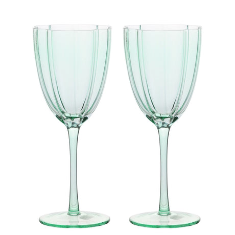 Pair of Scallop Edge Fluted Stemmed Wine Glasses in pale green glass, with vertical panelled bowls, scalloped rims, slender stems and flat round feet, shown on a plain white background.