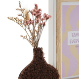 Close-up of the dark brown textured vase with dried pink flowers and grasses beside a wooden photo frame with white edge, 6 x 4in, holding a "Family Everyday" print.