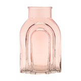 Light pink glass vase with a narrow neck and stepped arch design on the front, nested arches creating a layered look, shown on a plain white background.