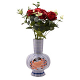 Hand-painted ceramic vase in periwinkle blue with a ribbed body, fluted striped neck, scalloped rim, and a textured orange crab design, shown with red roses on a white background.