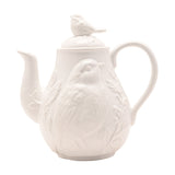White ceramic earthenware teapot with embossed bird and floral relief design, curved spout and handle, bird-shaped lid knob, 1300ml, on a plain background.