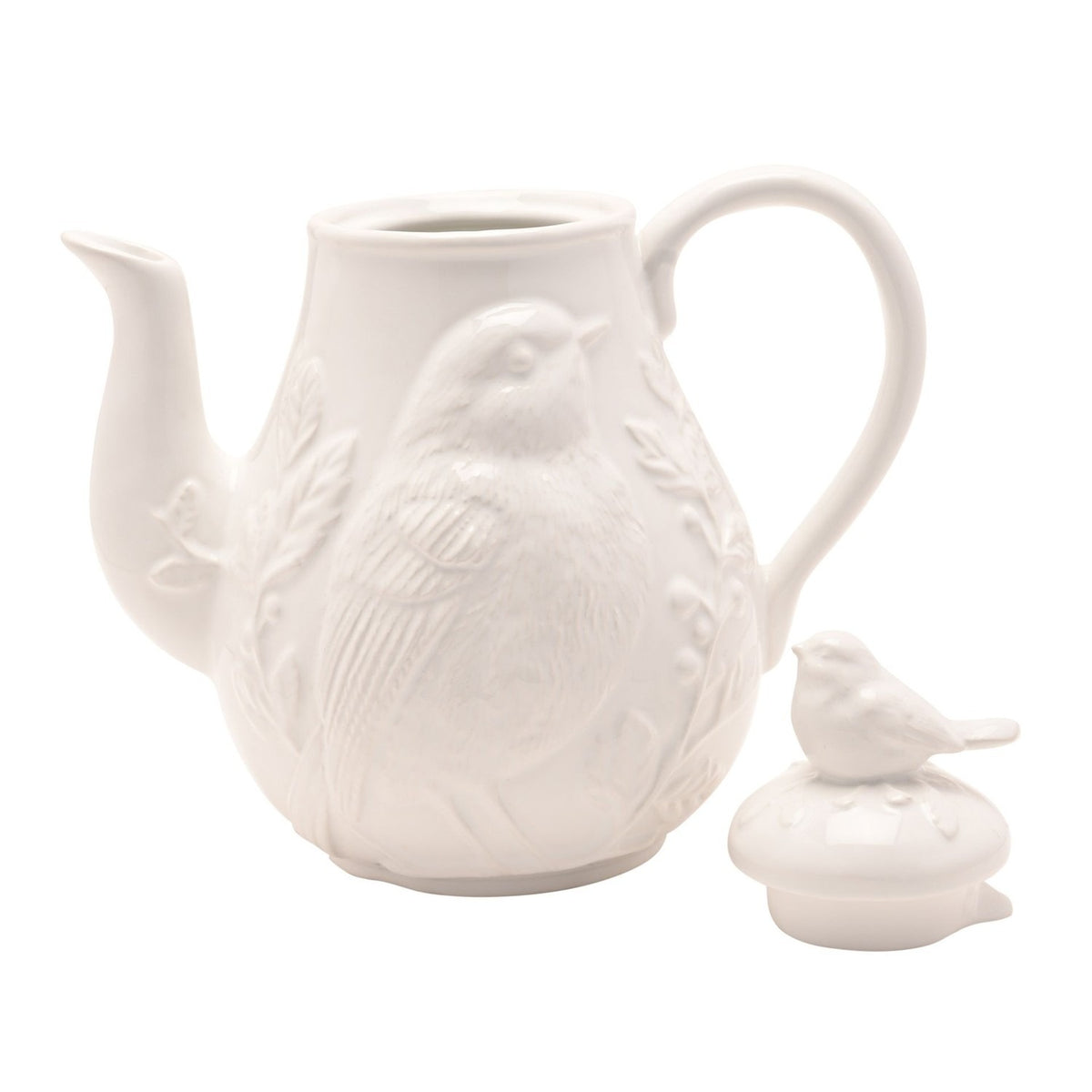 White earthenware teapot with embossed songbird, leaves and berries, curved handle and spout, bird-shaped knob on lid beside it, set on a plain white background.