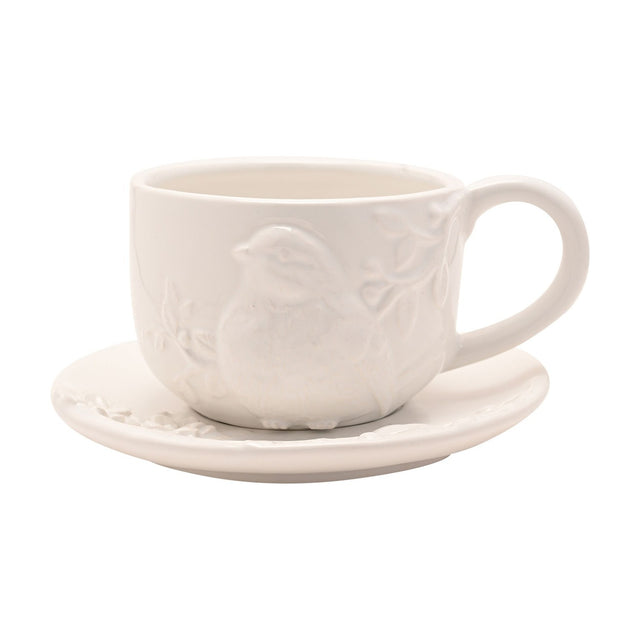 White earthenware teacup and saucer set with a raised bird and foliage design in relief on the cup, plain round saucer, 400ml, on a white background.