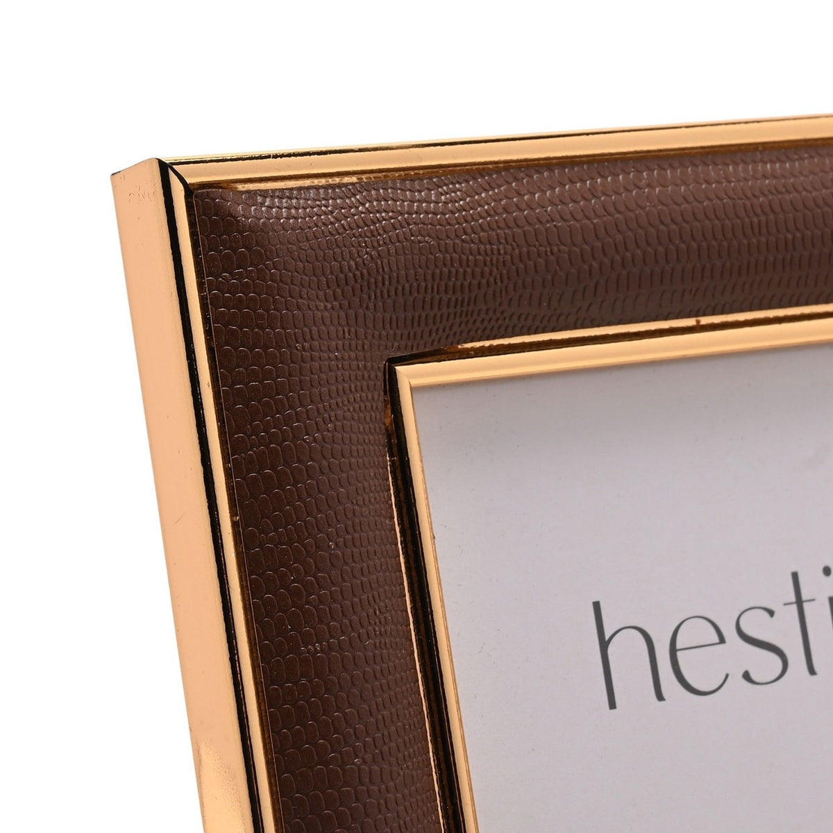 Close-up of a rectangular freestanding photo frame with a textured brown surround and gold-coloured edges, plastic material, shown on a plain white background.