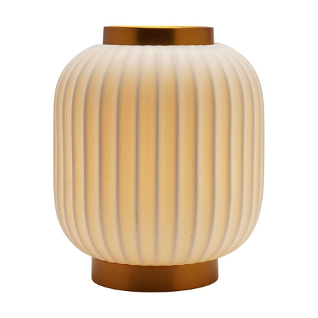 Small ribbed lantern-style porcelain table lamp in white with gold bands at crown and base, rounded ribbed shade, shown lit on a plain white background.