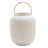 White porcelain lantern table lamp with rounded body, wide open rim, arched gold-coloured handle, and cut-out geometric lattice pattern around the middle, on a plain white background.