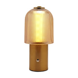 Ribbed Dome USB LED Touch Table Lamp with a champagne ribbed glass dome shade, brushed bronze cylindrical base, and gold-tone top cap, shown lit on a plain white background.