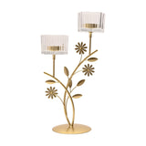 Floral Branch Double Metal Candle Holder in gold with daisy and leaf details on two stems, each topped with a clear ribbed glass cup, set on a round base against a plain white background.