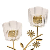 Floral Branch Double Metal Candle Holder in gold, featuring two clear ribbed, scalloped glass cups atop slender gold stems with daisy flower and leaf details, on a white background.