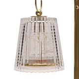 Close-up of a clear ribbed glass tapered shade hanging from a gold curled arm on this double LED table lamp, gold and clear finish.
