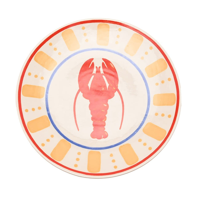 Round cream dinner plate with a central red lobster motif, encircled by a blue ring and a border of orange-yellow dashes, dots, and a red edge line, on a plain white background.
