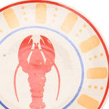 Round lobster dinner plate in cream with a central red lobster, blue ring border, and outer band of orange dashes and dots edged in red.