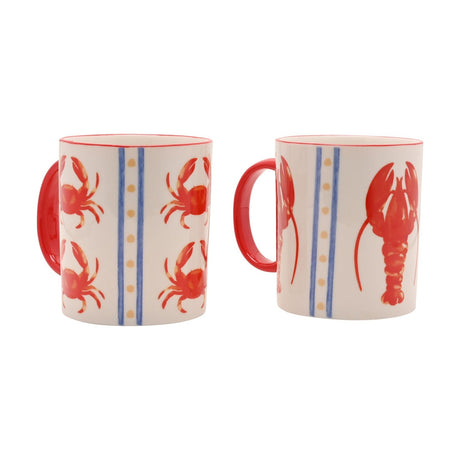 Set of 2 cream mugs with red handles, 360ml, one printed with red crabs and the other with a red lobster, separated by blue stripes and sandy dots, on a white background.