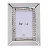 Rectangular mirrored glass photo frame with bevelled silver border and a diamante band of square and round stones, shown with a 4x6in insert on a white background.