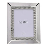 Rectangular mirrored glass photo frame with bevelled silver border and diamante stone band around a 5x7in opening, shown on a plain white background.