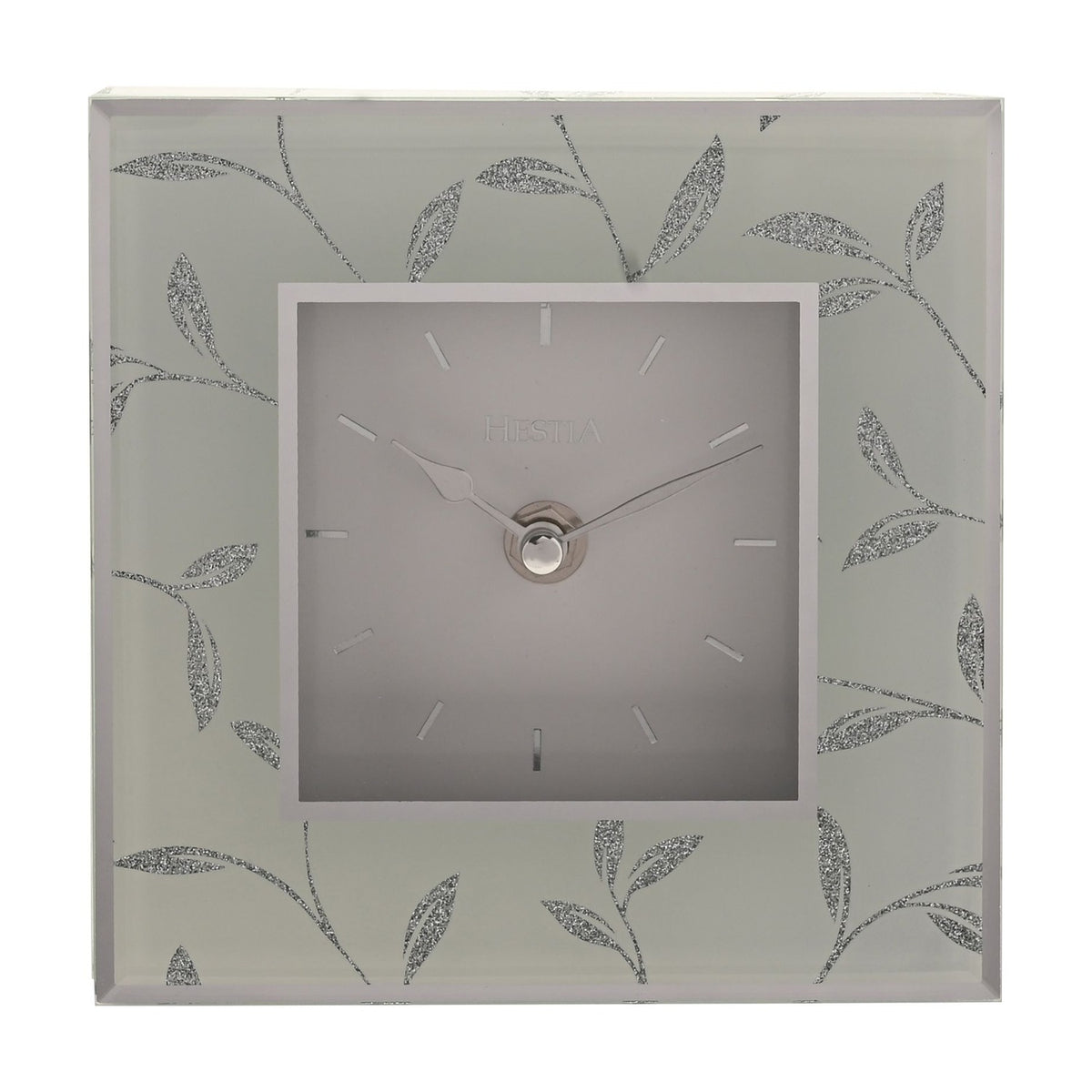 Square mantel clock with a grey square dial, baton markers, and silver hands, framed by a glitter leaf motif on a glass-effect grey border.