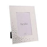 Silver glass photo frame with bevelled edge and clear diamante scatter detail across the lower corner, shown with rear easel stand on a plain white background.