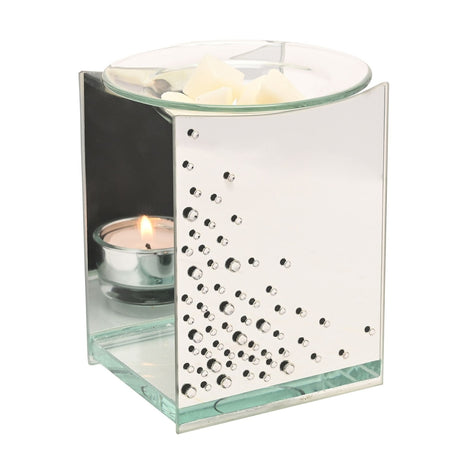 Rectangular mirrored silver glass wax melt burner with scattered clear diamante detail, open sides holding a lit tealight, and a round glass dish on top with wax melts, shown on a white background.