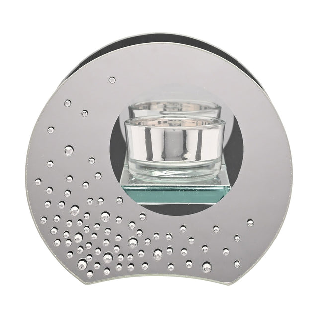 Round silver mirrored glass tealight candle holder with a clear glass votive in a circular cut-out window, scattered diamante crystals clustered along the lower edge, on a plain white background.