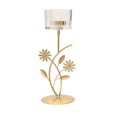 Gold metal single candle holder with floral and leaf stem design, round flat base, and clear ribbed glass cup with scalloped edge, on a plain white background.