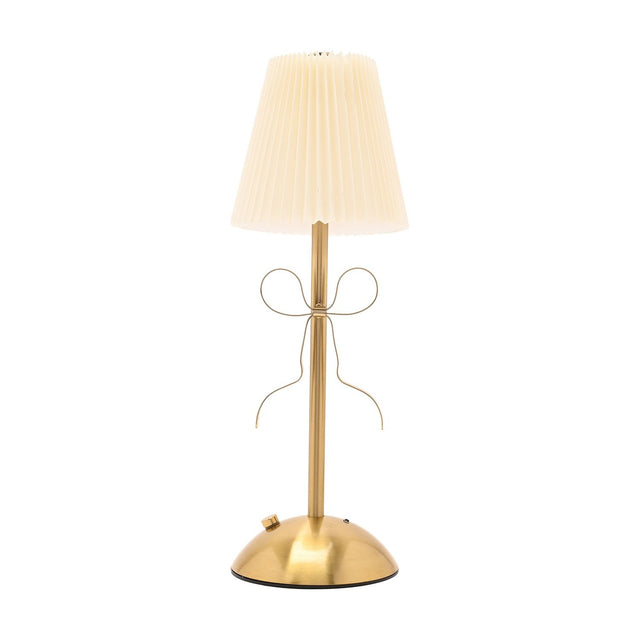 Brass Bow Pleated LED Touch Table Lamp with cream pleated shade, slim gold stem, and metal ribbon bow detail, on a dome base against a plain white background.