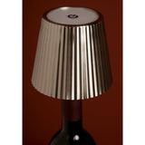 Round Wine Bottle Topper LED Touch Table Lamp in silver metal, pleated tapered shade with touch control on top, fitted onto a wine bottle neck.