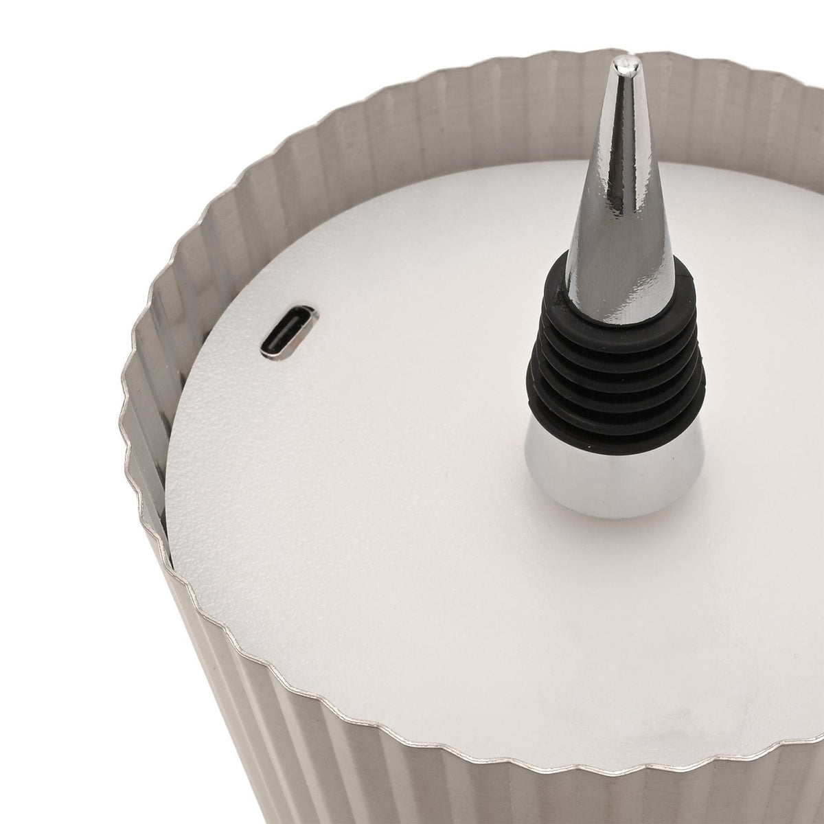Close-up of the Round Wine Bottle Topper LED table lamp in silver metal, showing the pleated ribbed shade, pointed spike with ridged black rings, and USB-C port on the base.