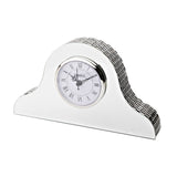 Silver Napoleon mantel clock with mirrored glass front, arched silver-tiled top, and white Roman numeral dial, shown on a plain white background.