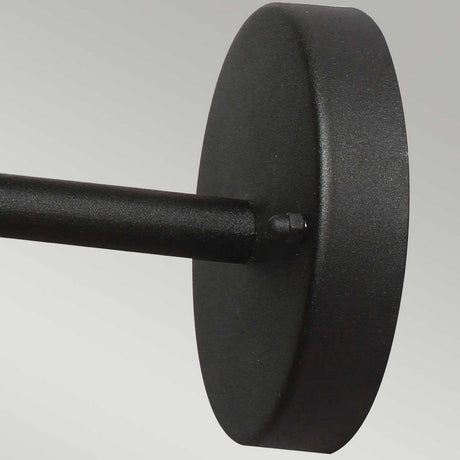 The Helsingor 1 Light Outdoor Wall Light - Black showcases a Danish-inspired design with a close-up of its matte black metal rod connected to a circular wall mount against a light gray background, exuding elegance and style.