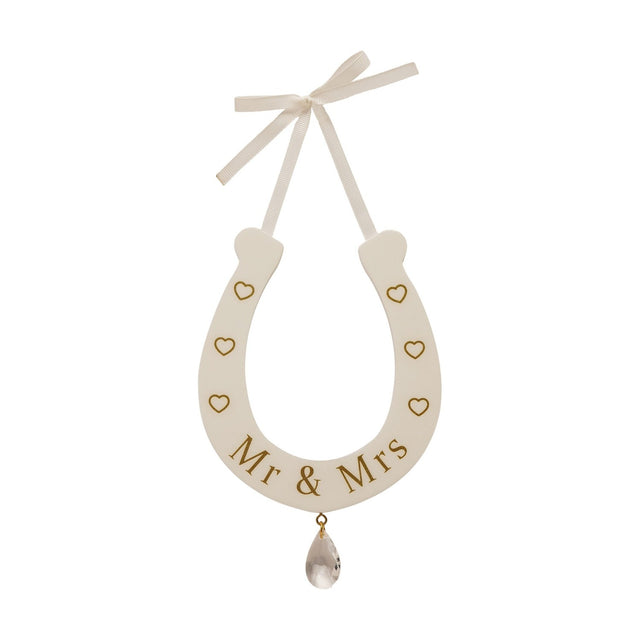 Cream MDF horseshoe wall art reading "Mr & Mrs" in gold with outline hearts, a cream ribbon bow hanger, and a clear teardrop drop, shown on a white background.