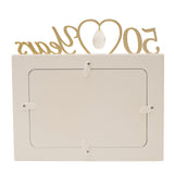 Cream MDF photo frame for a 6x4in photo, with gold "50 Years" lettering and an open heart holding a clear faceted drop above the top edge, shown on a plain white background.