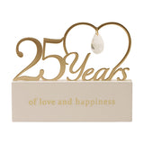 Wooden mantel plaque with gold cut-out "25 Years" rising into an open heart with a faceted drop, cream base reads "of love and happiness."