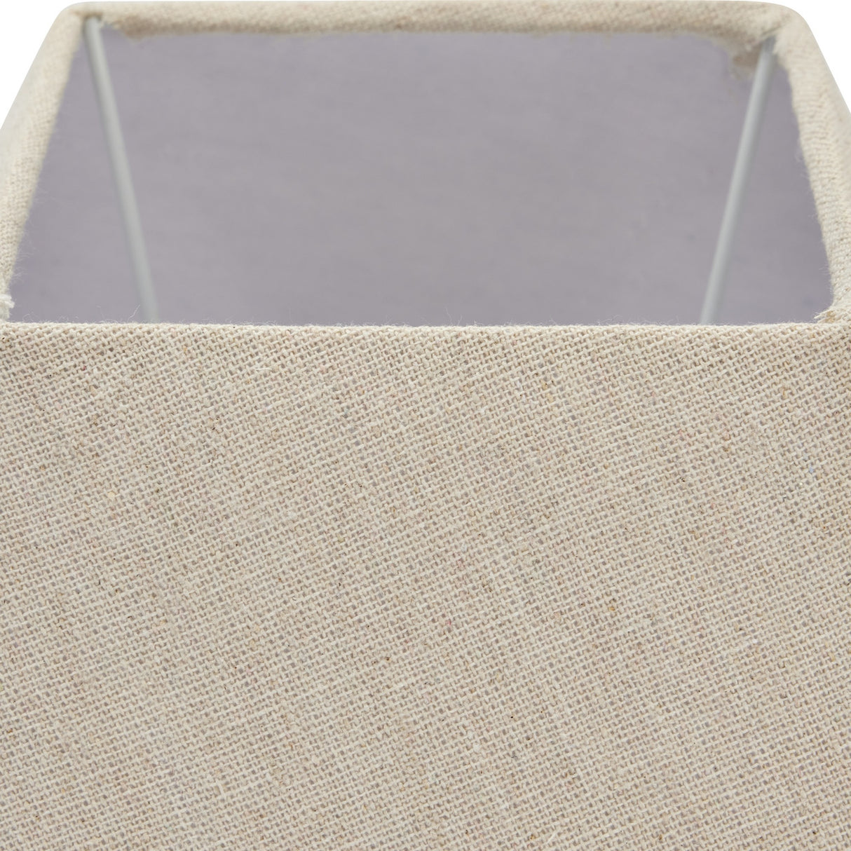 Close-up of the Hill Interiors Ormelle table lamp's natural linen square drum shade, showing the woven texture and internal wire frame.