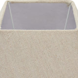 Close-up of the Hill Interiors Ormelle table lamp's natural linen square drum shade, showing the woven texture and internal wire frame.