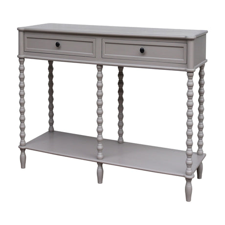 Hill Interiors Halvorne Large Two Drawer Console Table in grey wood with turned bobbin legs, lower shelf and dark round knobs, on a white background.