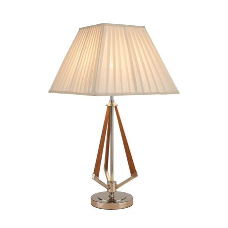The Hilton 1 Light Wood Table Lamp features a wood and nickel tripod base with a taupe finish and an ivory pleated shade, softly glowing when turned on.