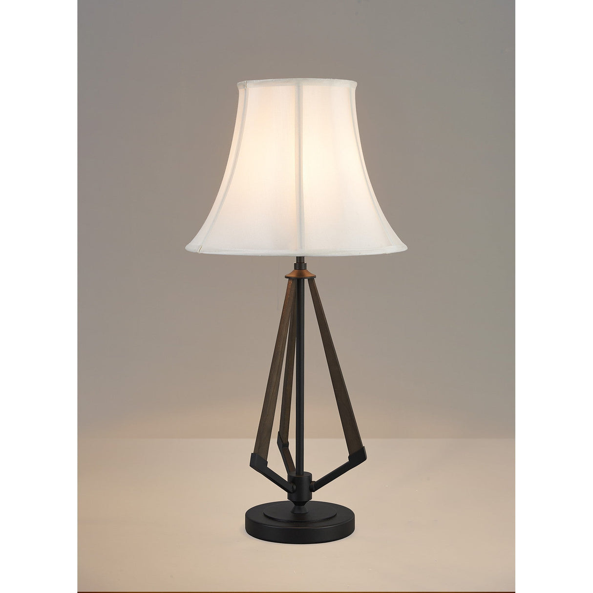The Hilton 1 Light Wood Table Lamp has a black and grey base with a cream shade, offering modern style on any light surface with its unique tripod design. Perfect for neutral settings and contemporary décor.