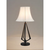 The Hilton 1 Light Wood Table Lamp has a black and grey base with a cream shade, offering modern style on any light surface with its unique tripod design. Perfect for neutral settings and contemporary décor.