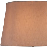 A close-up of the Hilton 1 Light Wood Table Lamp in black and grey with a taupe/halo gold shade, featuring subtle vertical texture, softly lit to highlight its contemporary elegance in warm neutral tones.